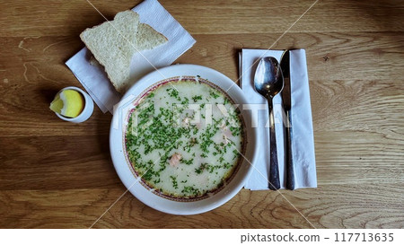 Homemade salmon and leek creamy soup in Norway. 117713635