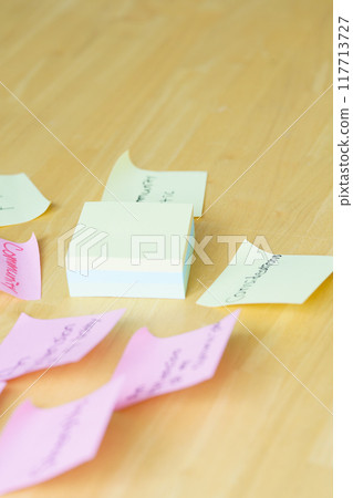 A young woman visualizing issues in the office A young woman visualizing issues in the office 117713727