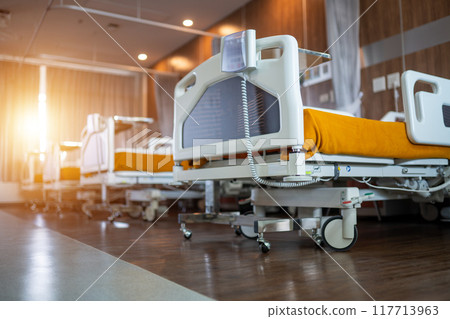 A hospital room with a bed and a phone 117713963