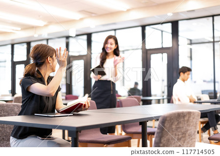 Women making an appointment to meet in the common area Women making an appointment to meet in the common area 117714505