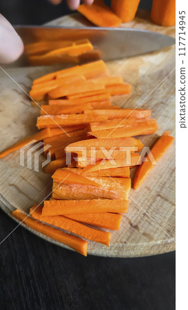 Carrot slices for cooking. Home cooking concept. Suitable for pilaf and stew. Carrot slices for cooking. Home cooking concept. Suitable for pilaf and stew. 117714945