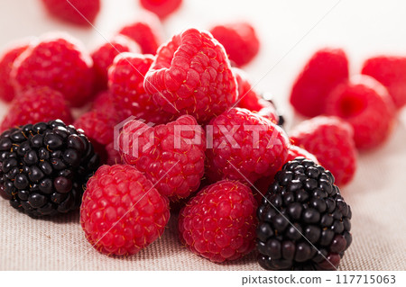 Fresh raspberry and blackberry berries on white background 117715063