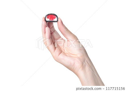 Mochi - Japanese dessert, sweets. From rice dough. A woman's hand holds a mochi candy, shows the size and berry red filling on white background photo Mochi - Japanese dessert, sweets. From rice dough. A woman's hand holds a mochi candy, shows the size and berry red filling on white background photo 117715156