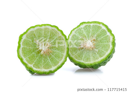 Kaffir lime slices close up on white background. 117715415
