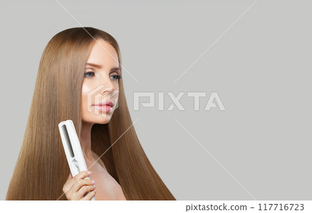 Good-looking model. Woman with long brown hair, natural makeup and healthy clean skin Good-looking model. Woman with long brown hair, natural makeup and healthy clean skin 117716723