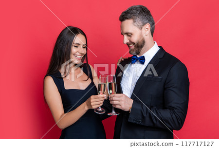 cheerful couple cheering and celebrate on background. photo of couple cheering and celebrate cheerful couple cheering and celebrate on background. photo of couple cheering and celebrate 117717127