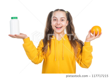 happy girl presenting multivitamin. organic food supplement. 117717215