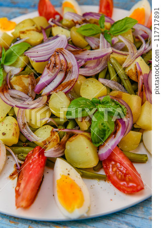 Fresh salad, green beans, small potatoes, egg, tomato, basil, red onions and balsamic vinaigrette Fresh salad, green beans, small potatoes, egg, tomato, basil, red onions and balsamic vinaigrette 117717891