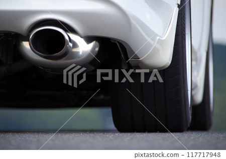 A low-angle photo of the rear wheel area of a high-performance passenger car 117717948