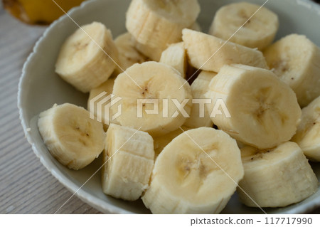 Sliced banana on the table at the kitchen 117717990