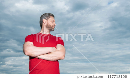 Confident man sky background. Serious man keeping arms crossed 117718106