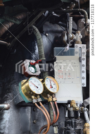 Cockpit of steam locomotive D51498: pressure gauge, pocket watch, and schedule 117718118