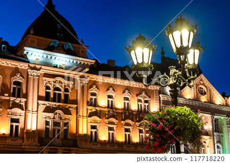 Vintage street iron lamp in the center of Novi sad in Serbia at night Vintage street iron lamp in the center of Novi sad in Serbia at night 117718220