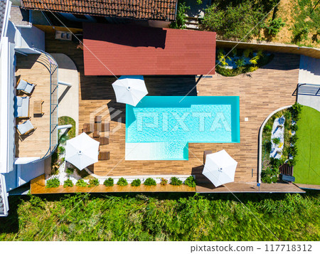 Top view of small beautiful villa with swimming pool and terrace 117718312