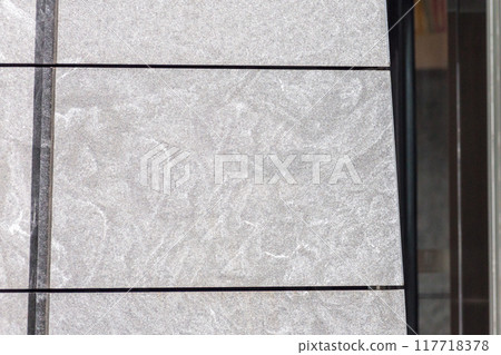 Concrete facade of an office building entrance. Empty space for logo or company name 117718378