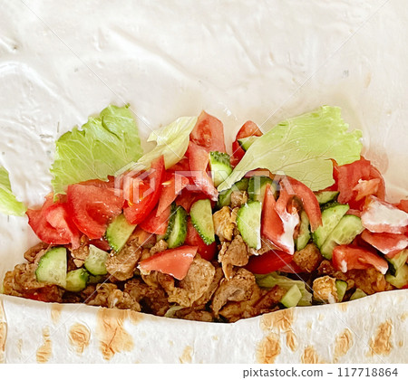 Fresh shawarma or chicken arabic doner sandwich with white background with copy space 117718864