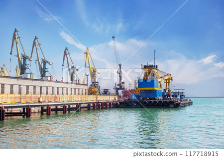 Industrial Seaport Novorossiysk in Russia. Port Cranes And Cargo Ships Industrial Seaport Novorossiysk in Russia. Port Cranes And Cargo Ships 117718915