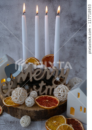 New year and Christmas preparation. Four-week advent candles on table. Handmade eco-friendly decor. Sustainable Christmas decoration 117718933