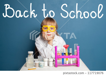 Schoolgirl kid looking at the camera. Back to school concept Schoolgirl kid looking at the camera. Back to school concept 117719076