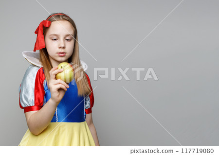 Young girl wearing snow white dress, Halloween concept Young girl wearing snow white dress, Halloween concept 117719080