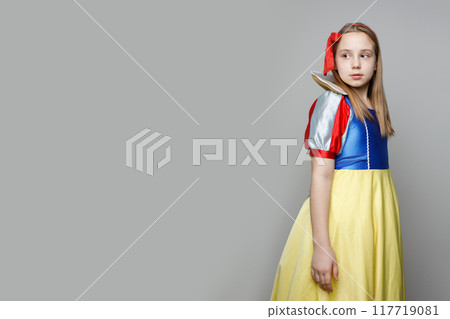 Attractive child girl theater actress on white background with copy space Attractive child girl theater actress on white background with copy space 117719081