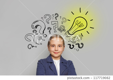 Successful child girl with light bulb and question marks on white background. Education Successful child girl with light bulb and question marks on white background. Education 117719082