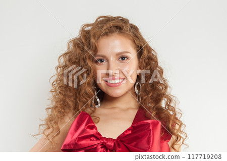 Glamorous young adult woman with fresh skin and wavy long healthy hairstyle isolated Glamorous young adult woman with fresh skin and wavy long healthy hairstyle isolated 117719208