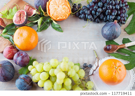 Food frame background. Grey wood board table with summer Fresh Fruit mix and copy cpace Food frame background. Grey wood board table with summer Fresh Fruit mix and copy cpace 117719411