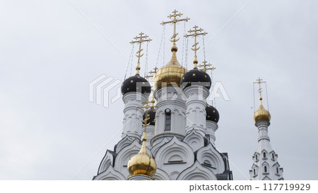 Bagrationovsk - August 23, 2024. The Temple of Faith, Hope, Love and their mother Sophia in Bagrationovsk, Russia. The domes of the temple.View of the Orthodox church in summer. Bagrationovsk - August 23, 2024. The Temple of Faith, Hope, Love and their mother Sophia in Bagrationovsk, Russia. The domes of the temple.View of the Orthodox church in summer. 117719929