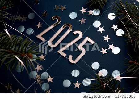 New Year 2025 blue background. Number of the coming year in Christmas decoration. New Year 2025 blue background. Number of the coming year in Christmas decoration. 117719995