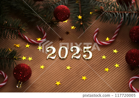 New Year 2025 beige background. Number of the coming year in Christmas decoration. 117720005