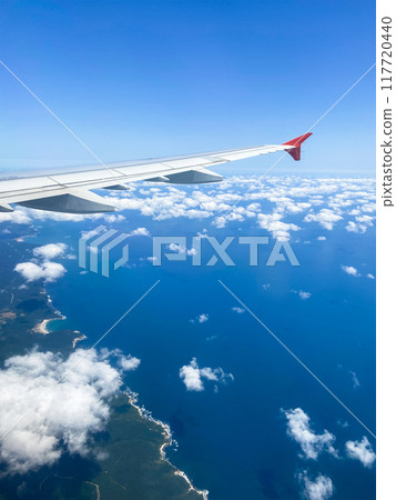 airplane wing and aerial view blue sea coastline airplane wing and aerial view blue sea coastline 117720440