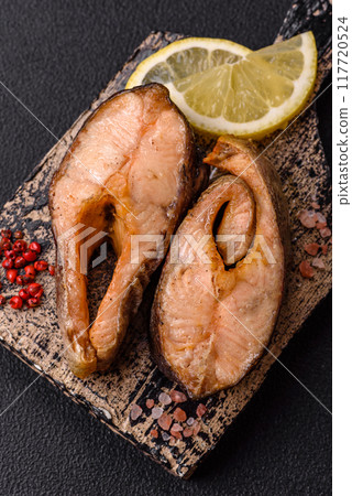 Delicious red salmon r trout fish grilled with spices and herbs 117720524
