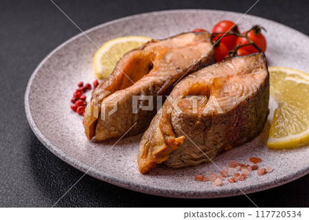 Delicious red salmon r trout fish grilled with spices and herbs Delicious red salmon r trout fish grilled with spices and herbs 117720534