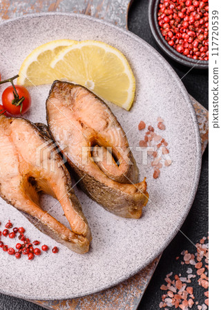 Delicious red salmon r trout fish grilled with spices and herbs Delicious red salmon r trout fish grilled with spices and herbs 117720539