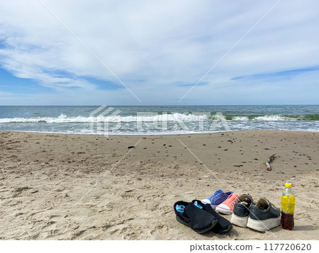 shoes on sand beach at Courish Spit in Kaliningrad 117720620