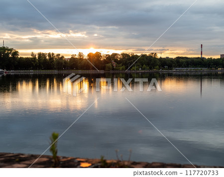 calm surface of water in pond in Kaliningrad calm surface of water in pond in Kaliningrad 117720733