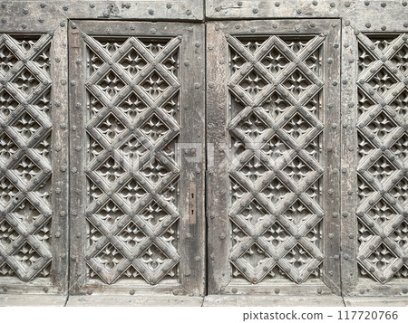 Old medieval decorated wooden door  117720766
