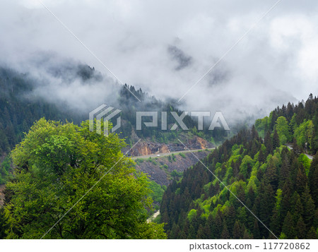 gray clouds over Old Silk Road on mountain slope gray clouds over Old Silk Road on mountain slope 117720862