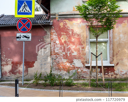shabby wall of urban house in Zelenogradsk town 117720979