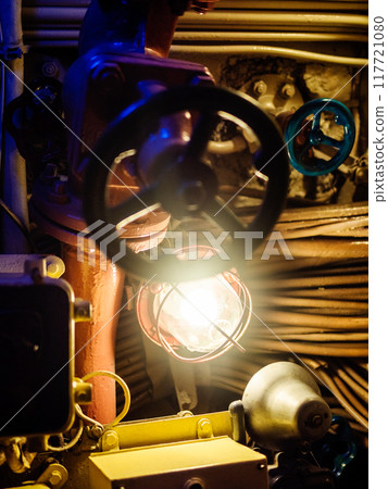 blue valve and lamp in old submarine close up blue valve and lamp in old submarine close up 117721080