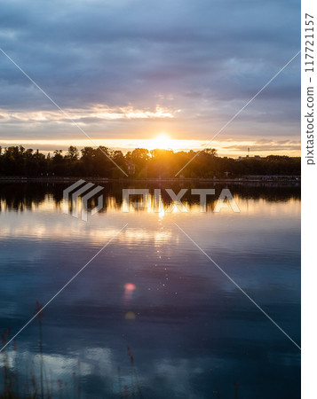 cold blue summer sunset over pond in Kaliningrad cold blue summer sunset over pond in Kaliningrad 117721157