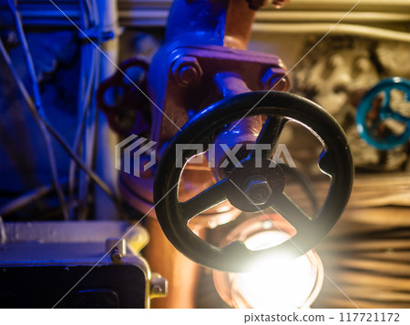 valve and electric lamp in old submarine close up 117721172