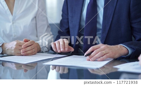 Business people and lawyers a contract papers before signing the agreement. Teamwork concept 117721938