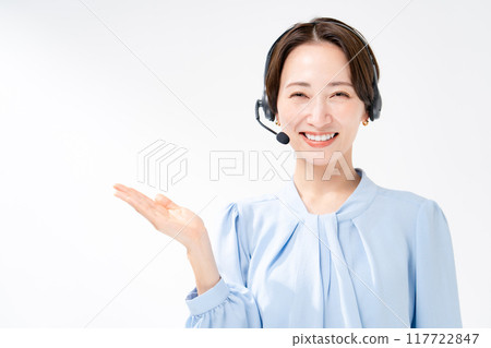 Woman wearing a headset, waving her hands 117722847