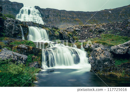 Dynjandi is one the most famous waterfall of the West Fjords of Iceland at summer Dynjandi is one the most famous waterfall of the West Fjords of Iceland at summer 117725016