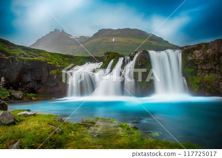 View to the Kirkjufell waterfall at summer. Kirkjufellsfoss waterfall, Iceland, Europe. 117725017