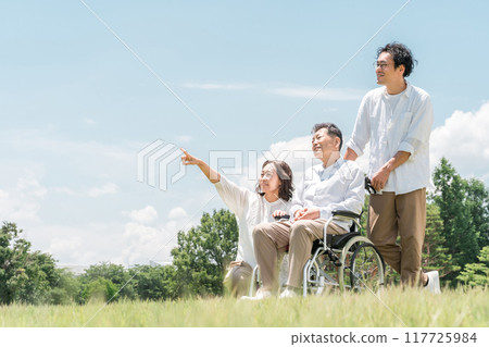 Parents and children walking in the park (caregiving, filial piety) 117725984
