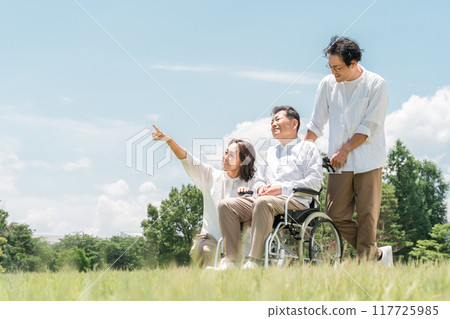Parents and children walking in the park (caregiving, filial piety) 117725985