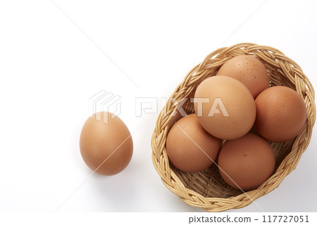 Chicken eggs in a basket Chicken eggs in a basket 117727051